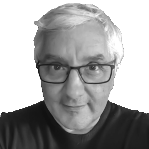 A black and white portrait of the author Marcus Whyte. He is an older man with short, light-coloured hair wearing rectangular glasses and a dark sweater. He is looking directly at the camera with a slight smile.